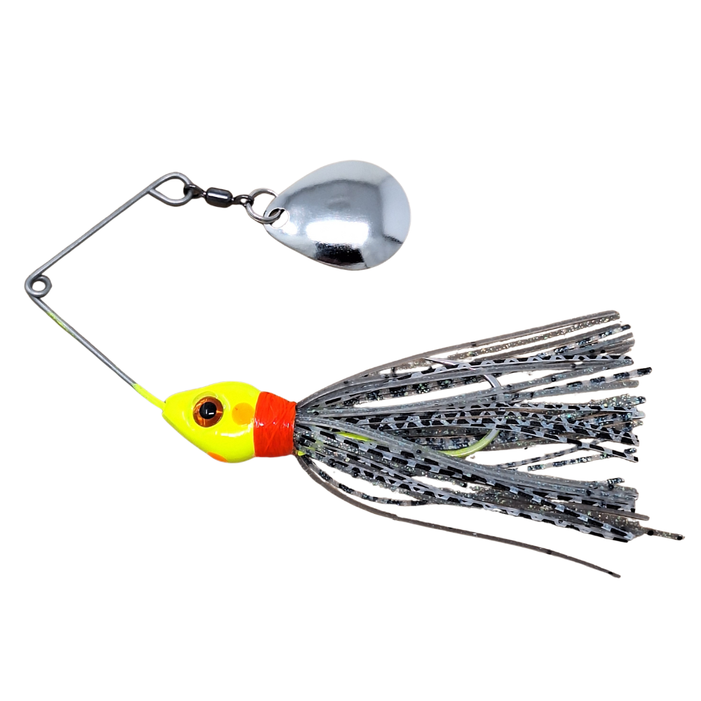 Fishing lure with a shiny yellow head and colorful skirt on a white background